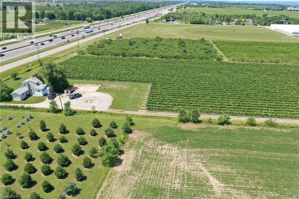 Expansive agricultural land featuring multiple cultivated fields and mature tree rows - 3705 Service Road N, Beamsville, ON
