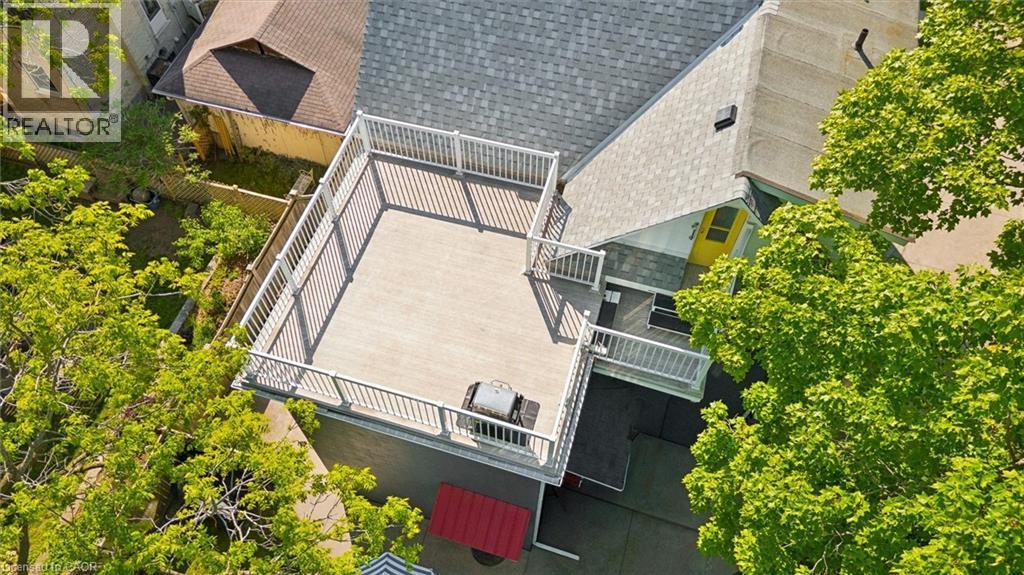 Expansive rooftop deck featuring composite decking and white railings - 149 Young Street, Kitchener, ON - Outdoor