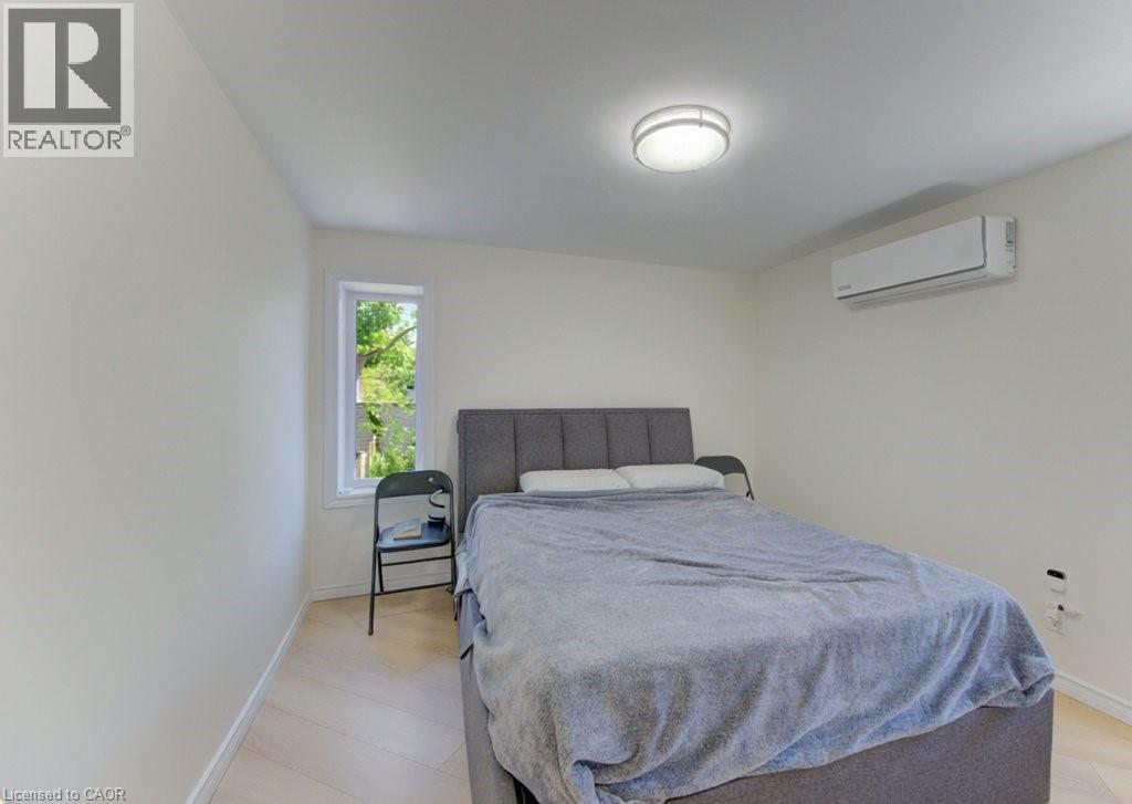 Bright interior space featuring light-toned walls and wood-finish flooring - 11 Davidson Street, Cambridge, ON