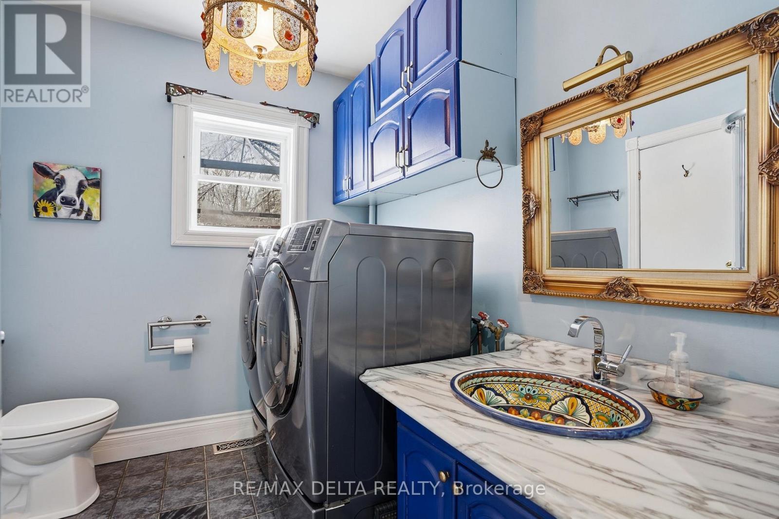 Laundry room, bath with shower, off kitchen. - 132 High Street, Champlain, ON