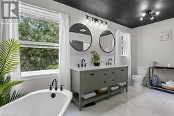 Freestanding Tub Overlooking Backyard -