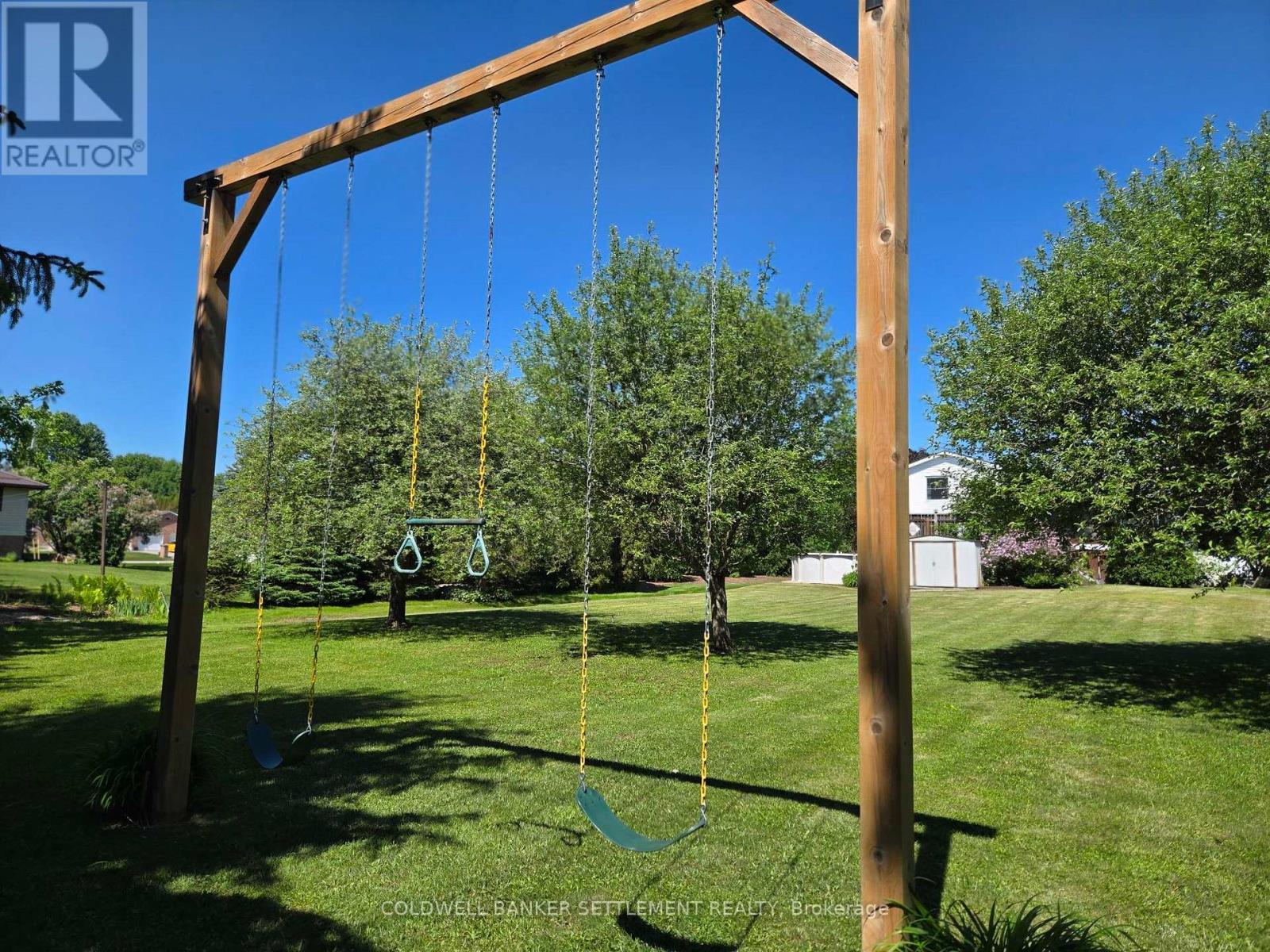 Swing set behind the apple trees - 12 Cornell Crescent, Elizabethtown-Kitley, ON