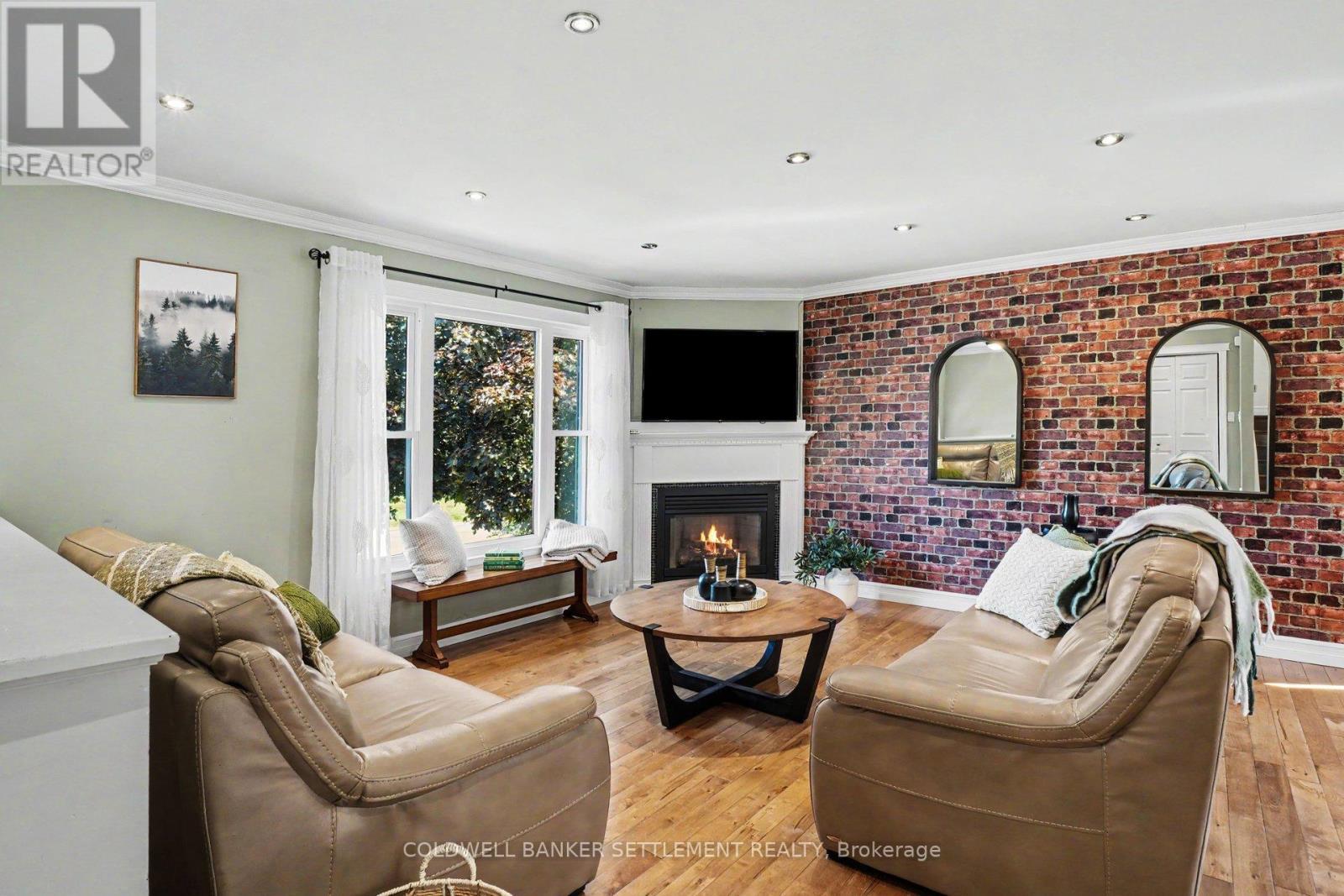 Open concept living room with gas fireplace - 12 Cornell Crescent, Elizabethtown-Kitley, ON
