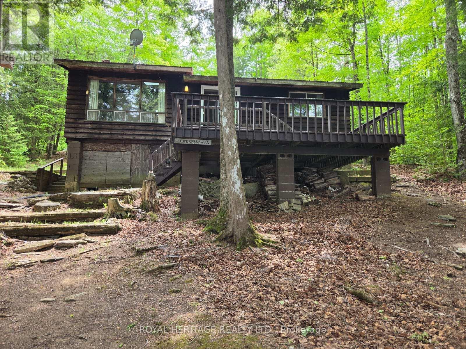 **Facing The Lake** - 1160 Sunset Strip Lane, Frontenac, ON - Outdoor With Deck Patio Veranda