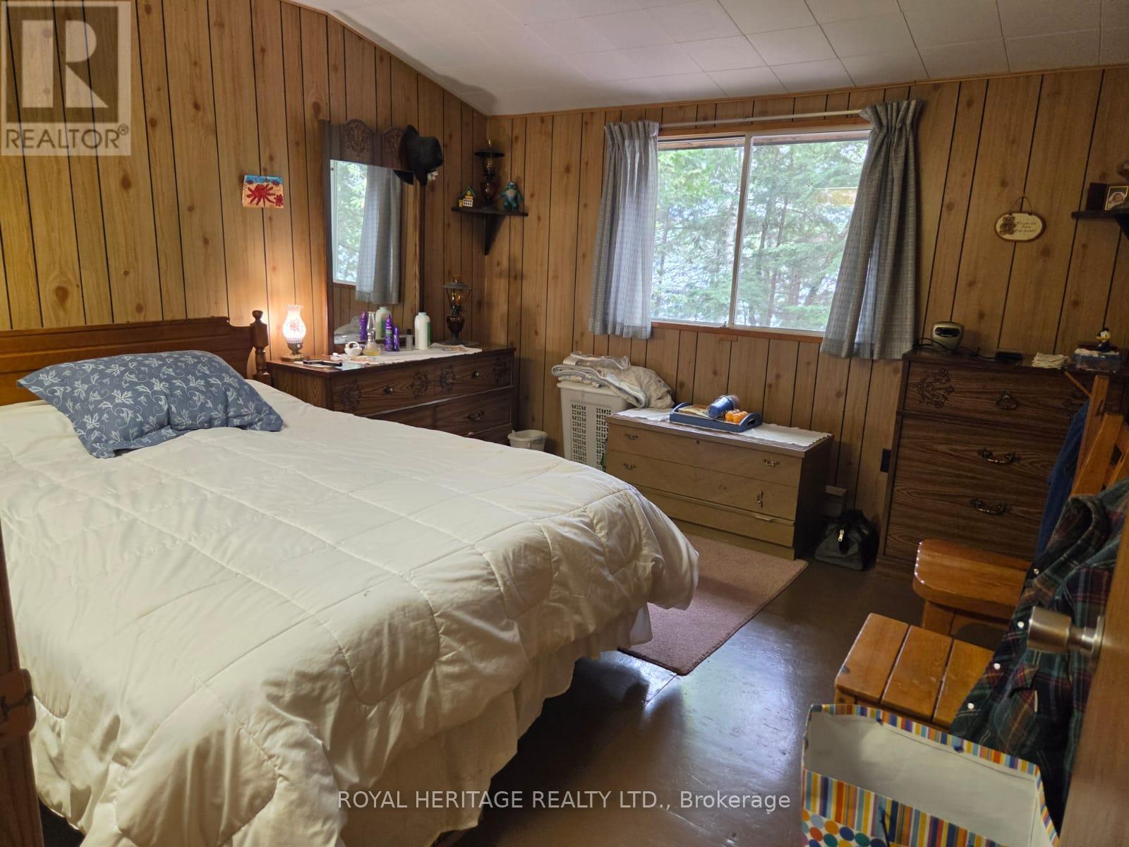 **Primary Bedroom On Main Floor** - 1160 Sunset Strip Lane, Frontenac, ON - Indoor Photo Showing Bedroom