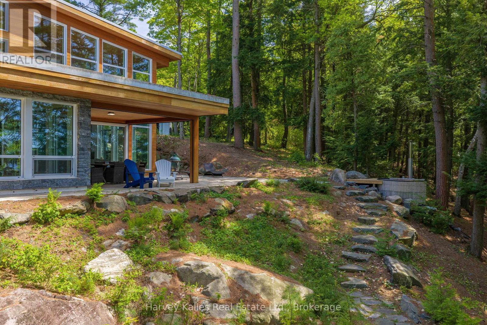 Lakeside of the cottage with wood fired hot tub - 43 Houston Lane, Seguin, ON