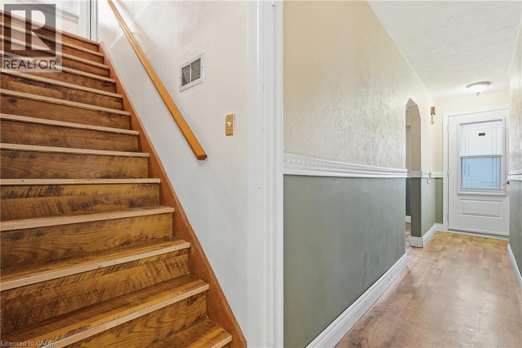 Stairs with wood finished floors and arched walkways - 549 Weber Street E, Kitchener, ON