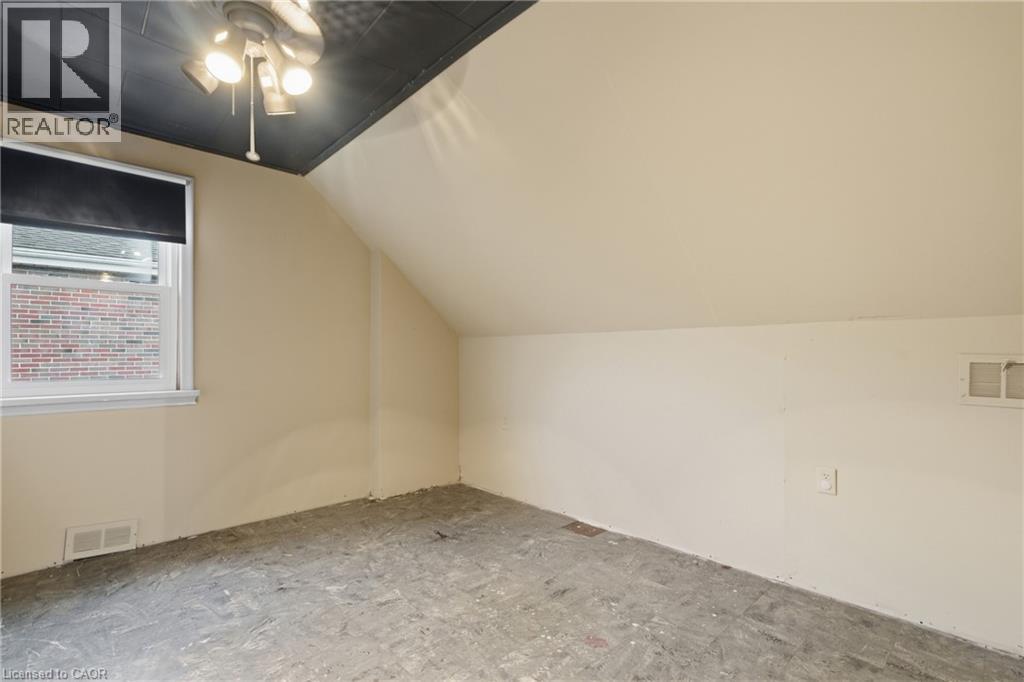 Additional living space featuring vaulted ceiling and a ceiling fan - 549 Weber Street E, Kitchener, ON
