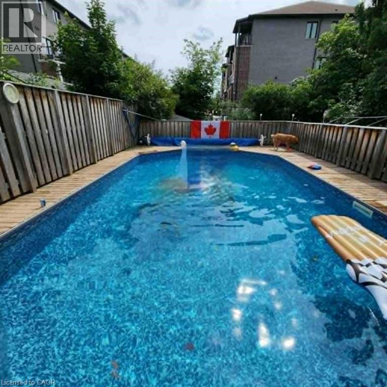 View of pool with a fenced backyard - 549 Weber Street E, Kitchener, ON