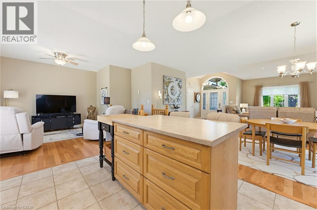 Central kitchen island with ample drawer storage and a light-toned countertop - 5 Coastal Court, Port Dover, ON