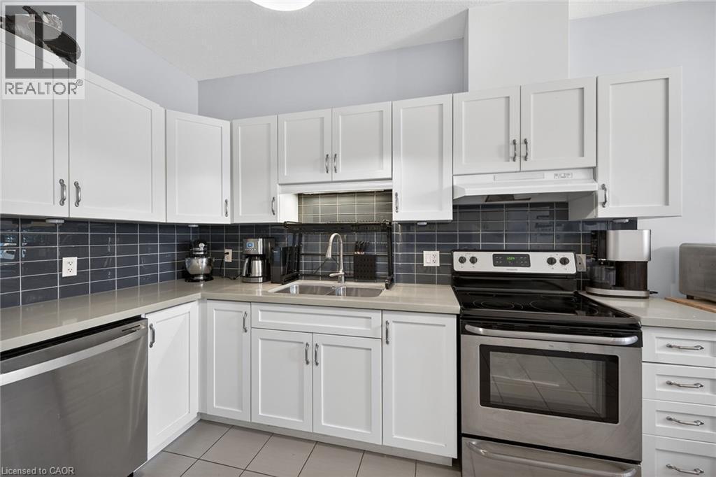 Pop of colour in these fabulous subway tiles! - 6 Gaddye Lane, Binbrook, ON - Indoor Photo Showing Kitchen