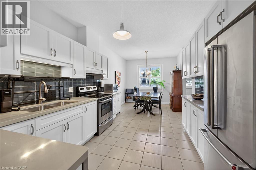 Stainless appliances included - 6 Gaddye Lane, Binbrook, ON - Indoor Photo Showing Kitchen With Double Sink With Upgraded Kitchen