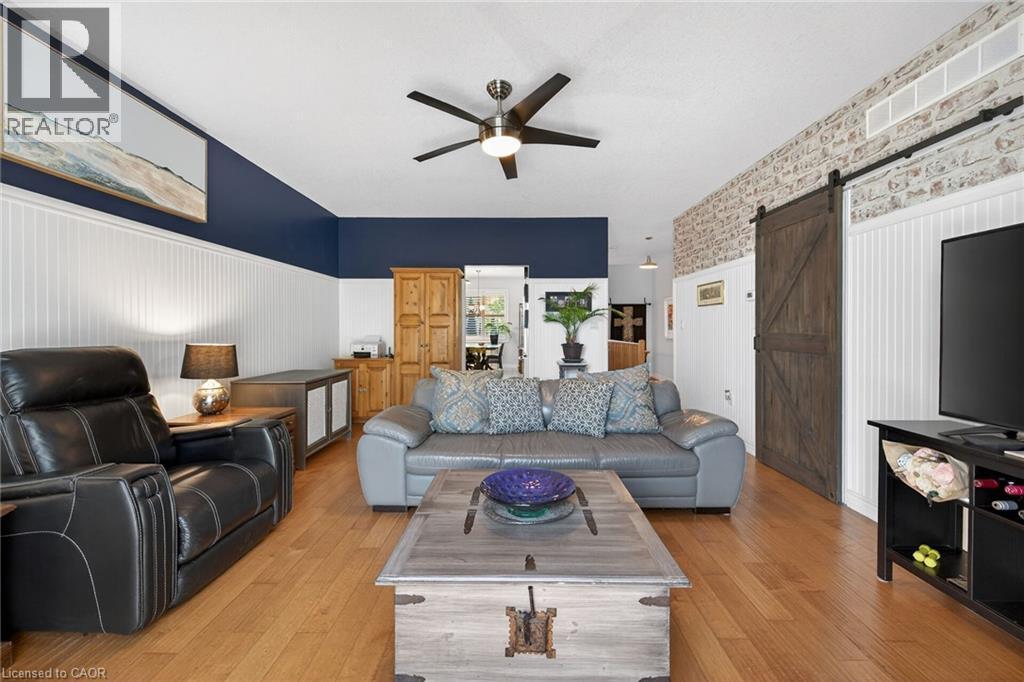 Gorgeous beadboard wainscotting in the living room is a lovely contrast to the hardwood flooring. - 6 Gaddye Lane, Binbrook, ON - Indoor Photo Showing Living Room