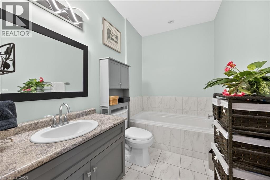 Generous ensuite with separate tub. - 6 Gaddye Lane, Binbrook, ON - Indoor Photo Showing Bathroom