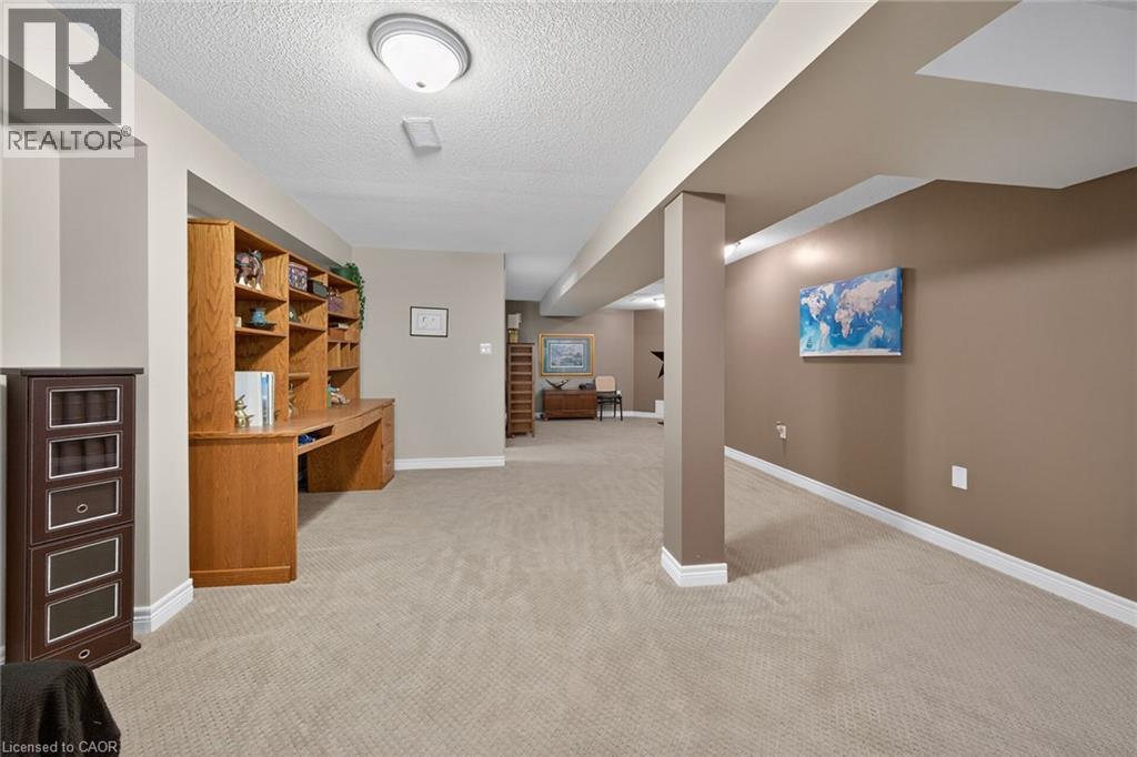 Neutral decor and carpeting. - 6 Gaddye Lane, Binbrook, ON - Indoor Photo Showing Other Room