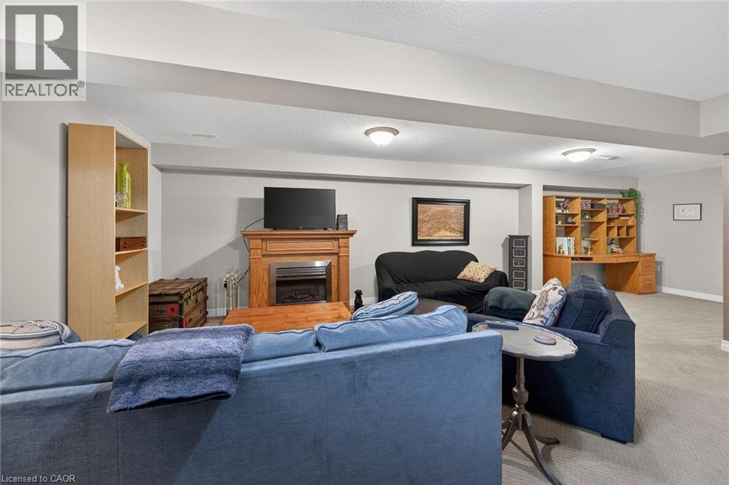 Electric fireplace included. - 6 Gaddye Lane, Binbrook, ON - Indoor Photo Showing Living Room With Fireplace
