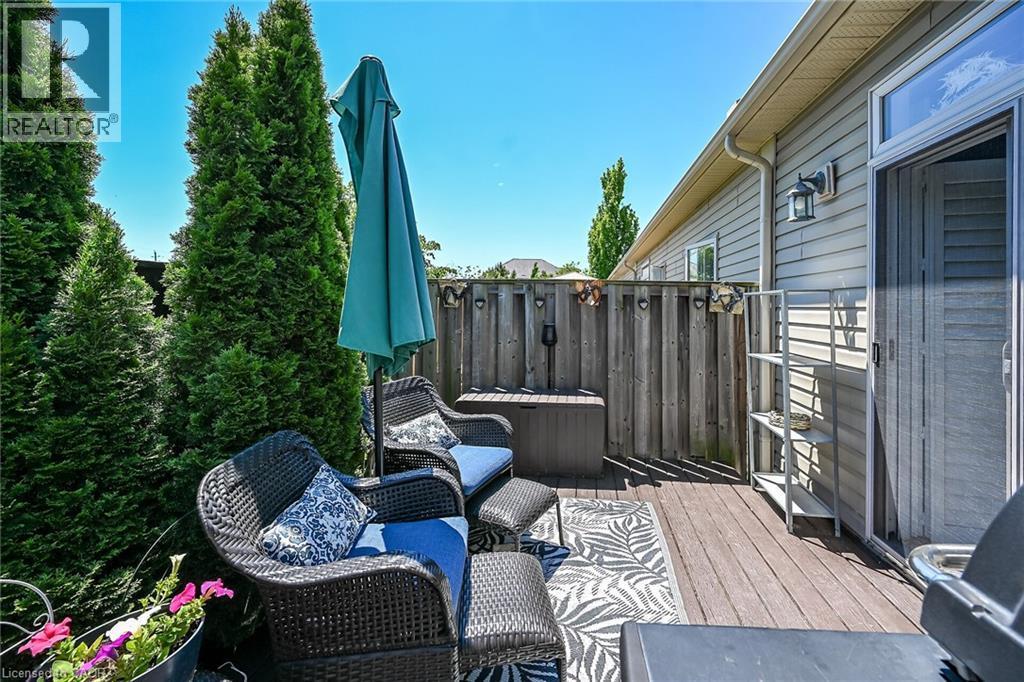 A little privacy, greenery and convenient spot for the BBQ. - 6 Gaddye Lane, Binbrook, ON - Outdoor With Deck Patio Veranda With Exterior
