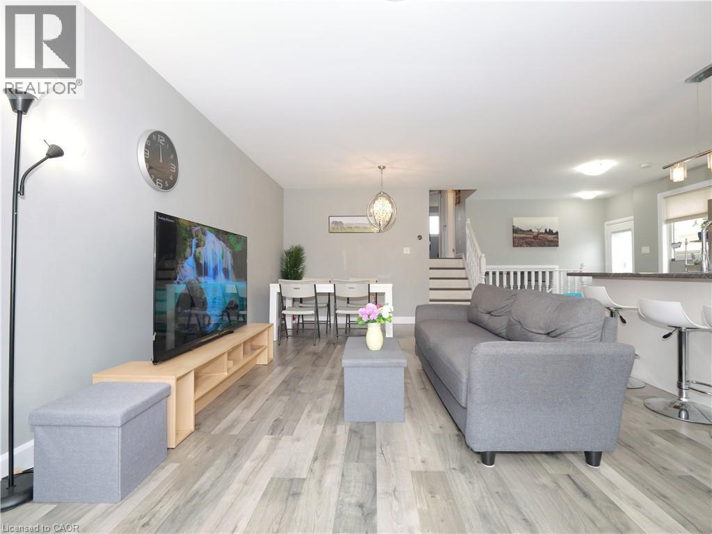 Open-concept living space featuring wood-finish flooring throughout - 771 Monsarrat Avenue, London, ON
