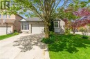 Brick facade residence featuring a front entry with sidelights, a bay window, and an attached single-car garage - 50 Spadara Drive, Hamilton, ON  - Outdoor 