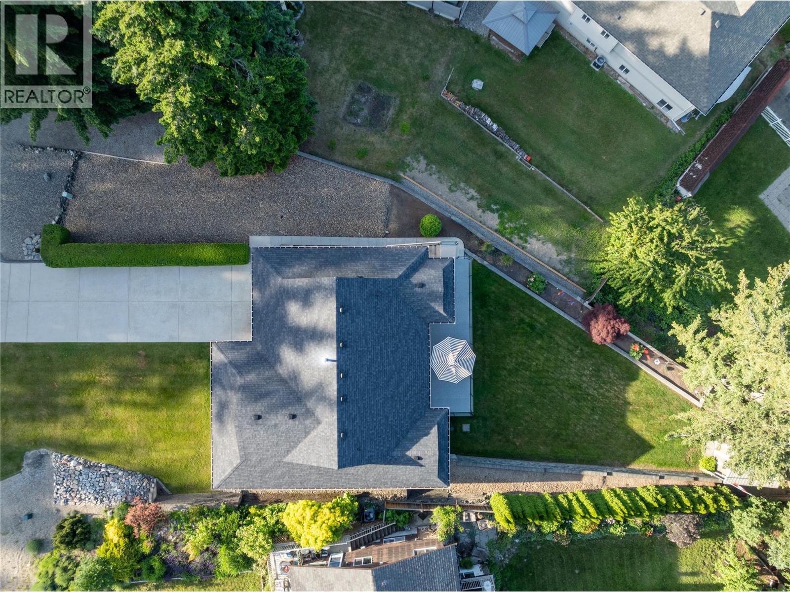 lots of parking in the flat driveway plus extra parking in the gravel driveway pad. - 2934 Juniper Crescent, Sorrento, BC