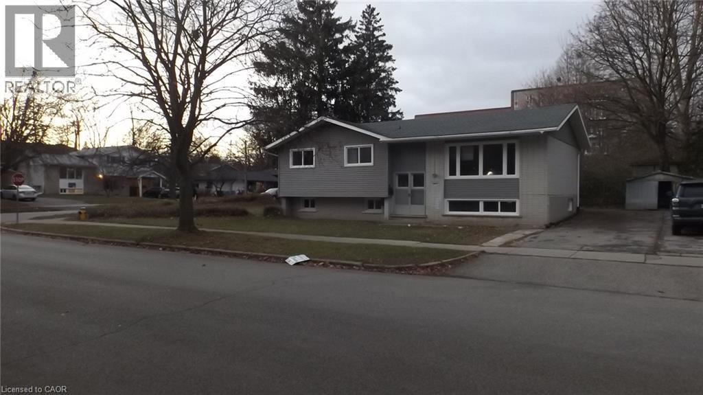 Split-level residence featuring a gray exterior with contrasting white trim - 68 Austin Drive, Waterloo, ON - Outdoor With Facade
