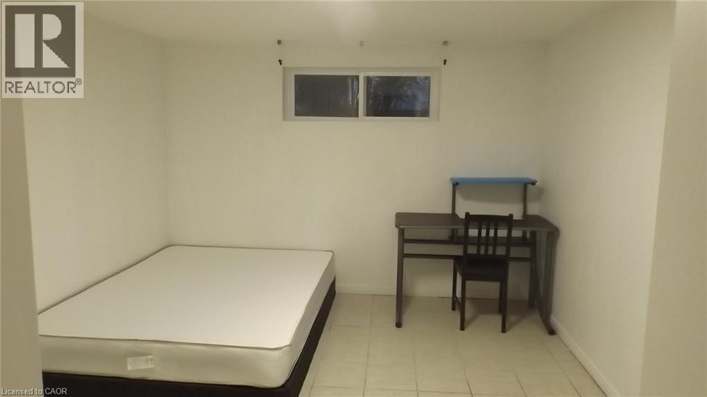 Room featuring white painted walls and light-colored tile flooring - 68 Austin Drive, Waterloo, ON - Indoor Photo Showing Other Room