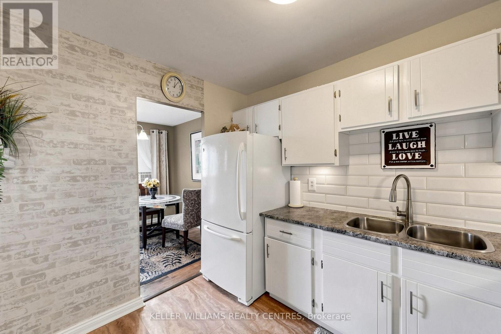 304 - 131 Taunton Road E, Oshawa, ON - Indoor Photo Showing Kitchen With Double Sink