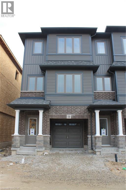 Three-story townhome featuring a dark brick facade, gray siding, and a single-car garage - 124 Compass Trail Unit# 14, Cambridge, ON