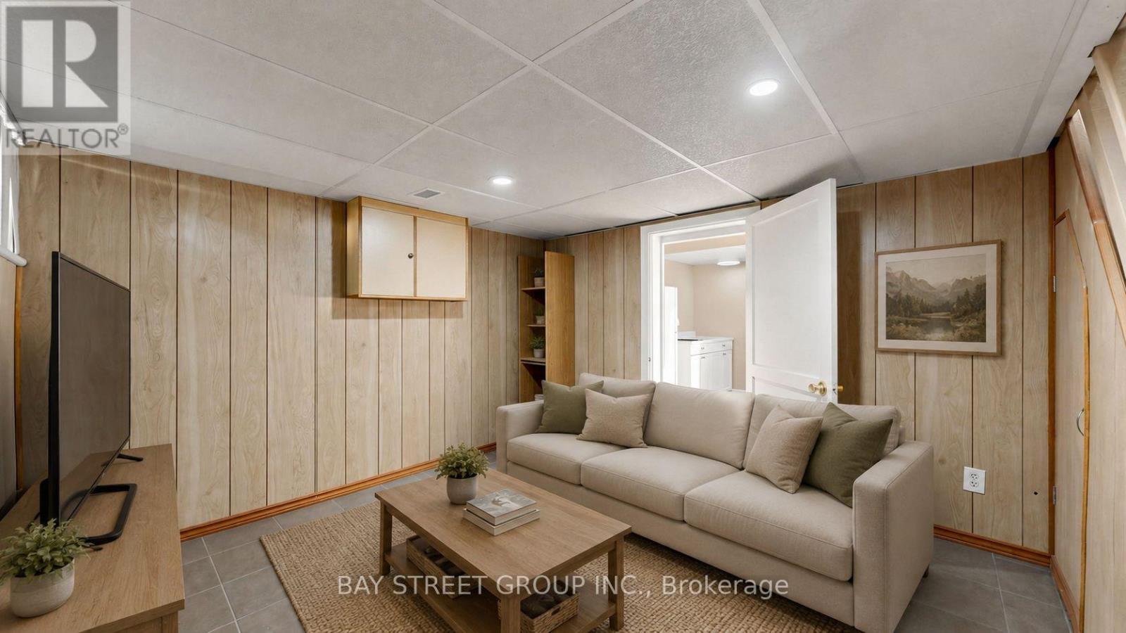 Basement Living Room- AI stag - 26 Innismore Crescent E, Toronto, ON