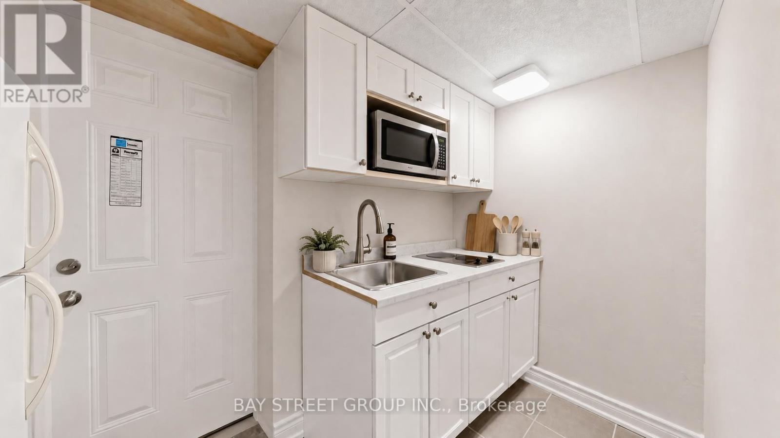 Basement Kitchen - AI Stage - 26 Innismore Crescent E, Toronto, ON