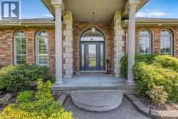 Brick facade with stone accents and a covered entryway -