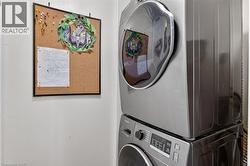 Stackable washer and dryer unit with a visible control panel -