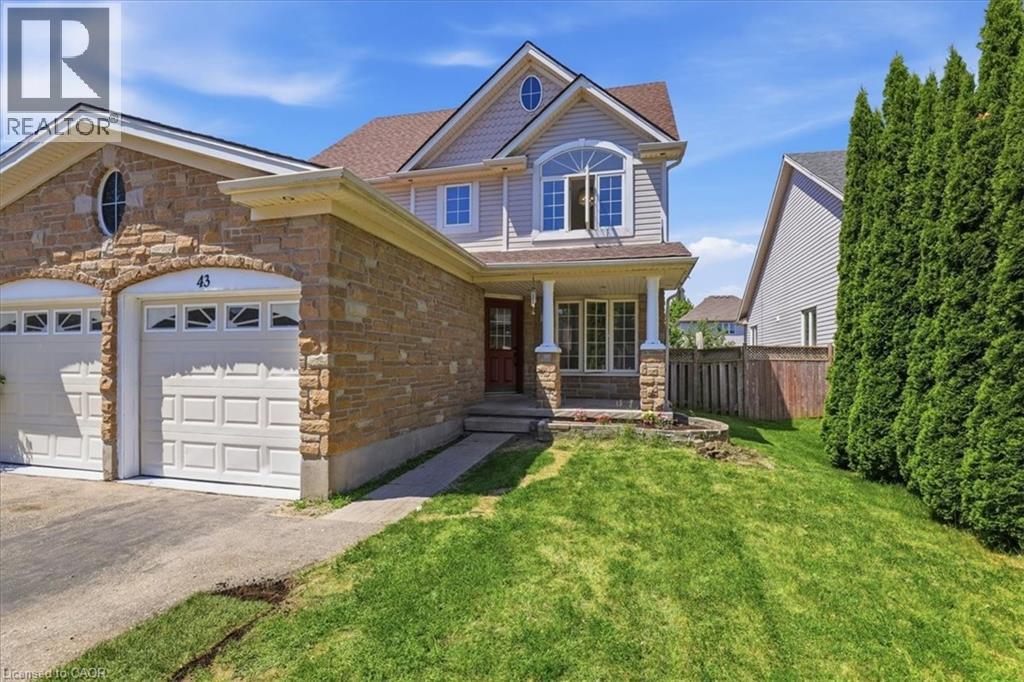 Stone and siding exterior with a two-car garage - 43 Decaro Crescent, Cambridge, ON