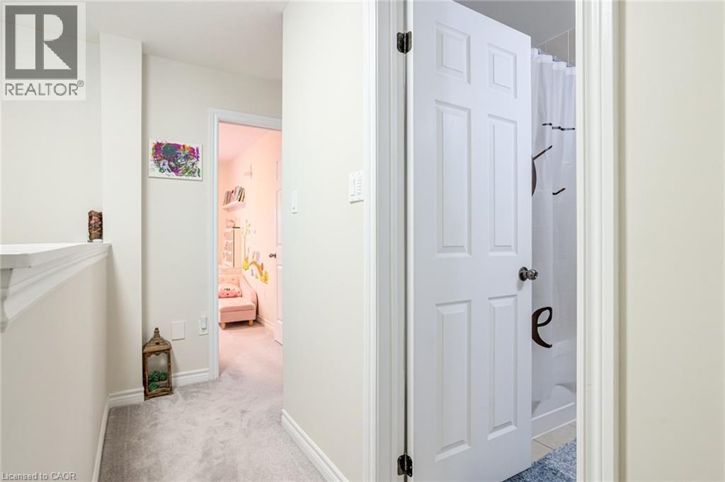 Hallway featuring light gray carpeting and white trim - 7 Sirente Drive Unit# 11, Hamilton, ON - Indoor Photo Showing Other Room