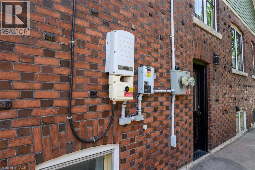 Red brick exterior with varied brickwork patterns - 22 Connaught Avenue S, Hamilton, ON
