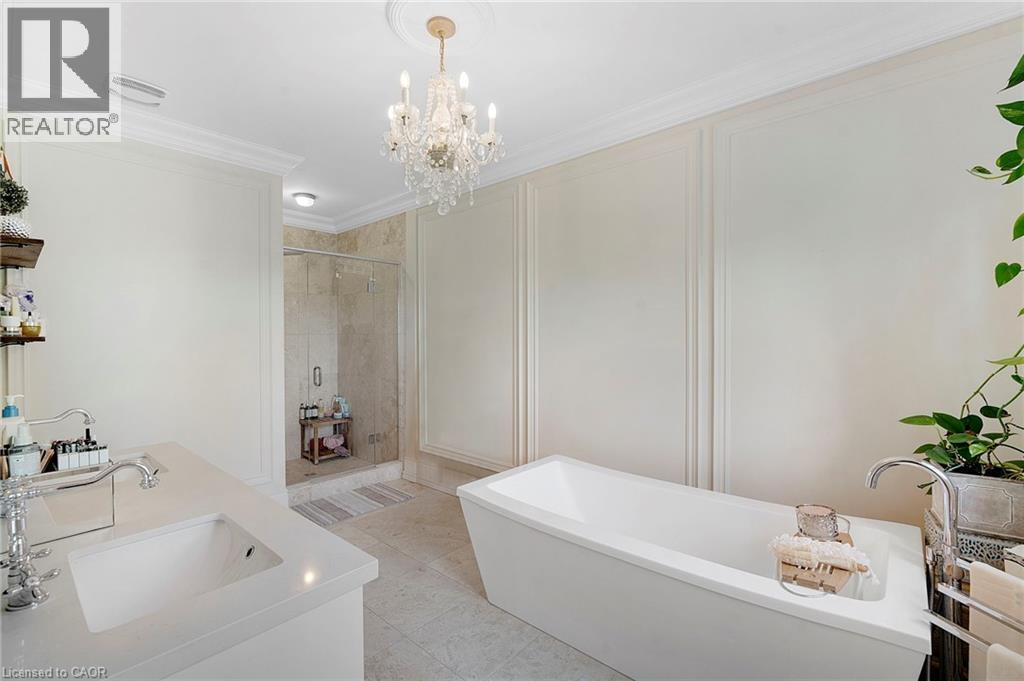 Freestanding soaking tub with floor-mounted faucet - 6195 Milburough Line, Burlington, ON - Indoor Photo Showing Bathroom