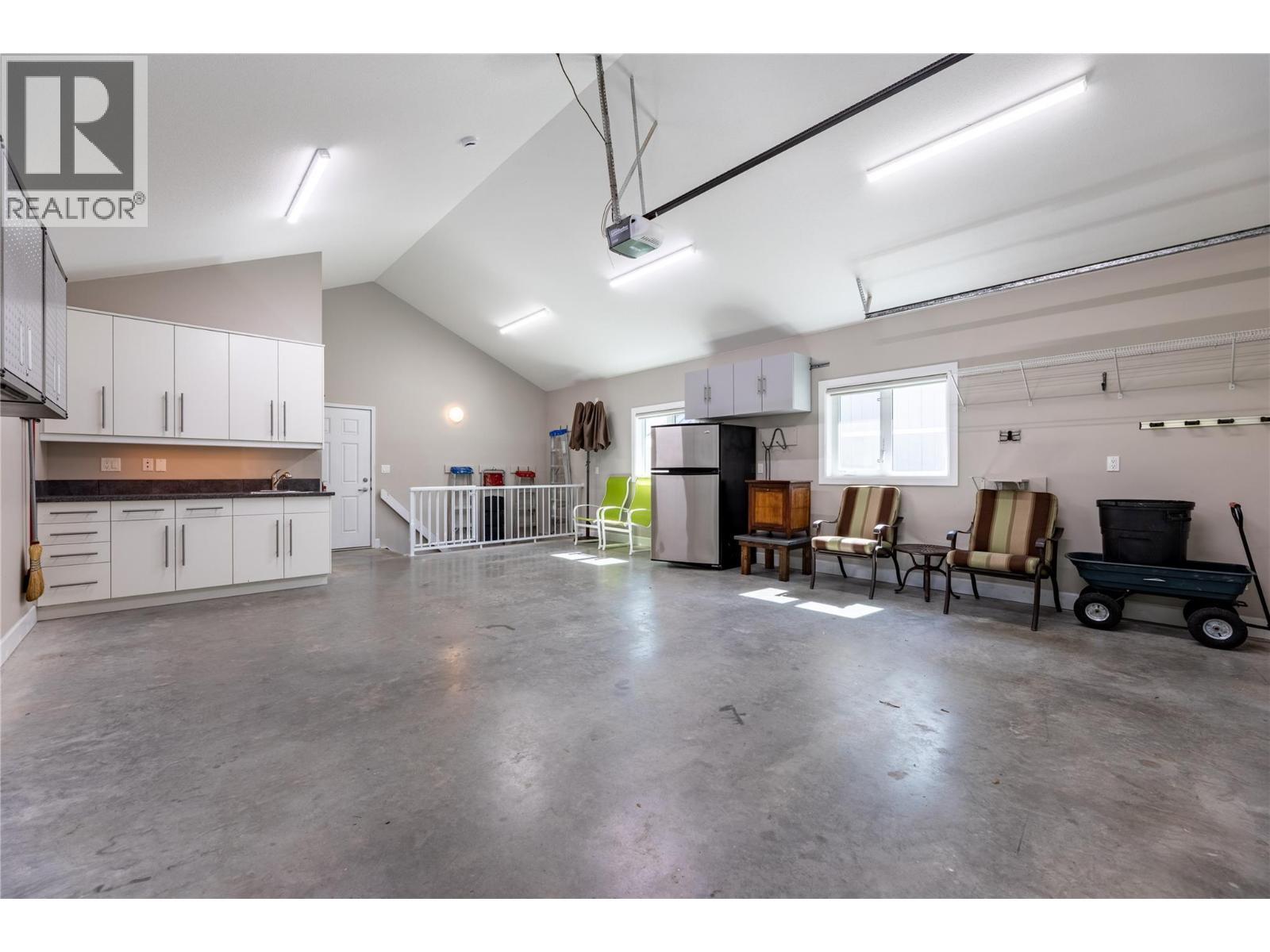 garage has handy entrance into the main floor and back stairs to the storage and basement area as well. - 6421 Eagle Bay Road Unit# 13, Eagle Bay, BC