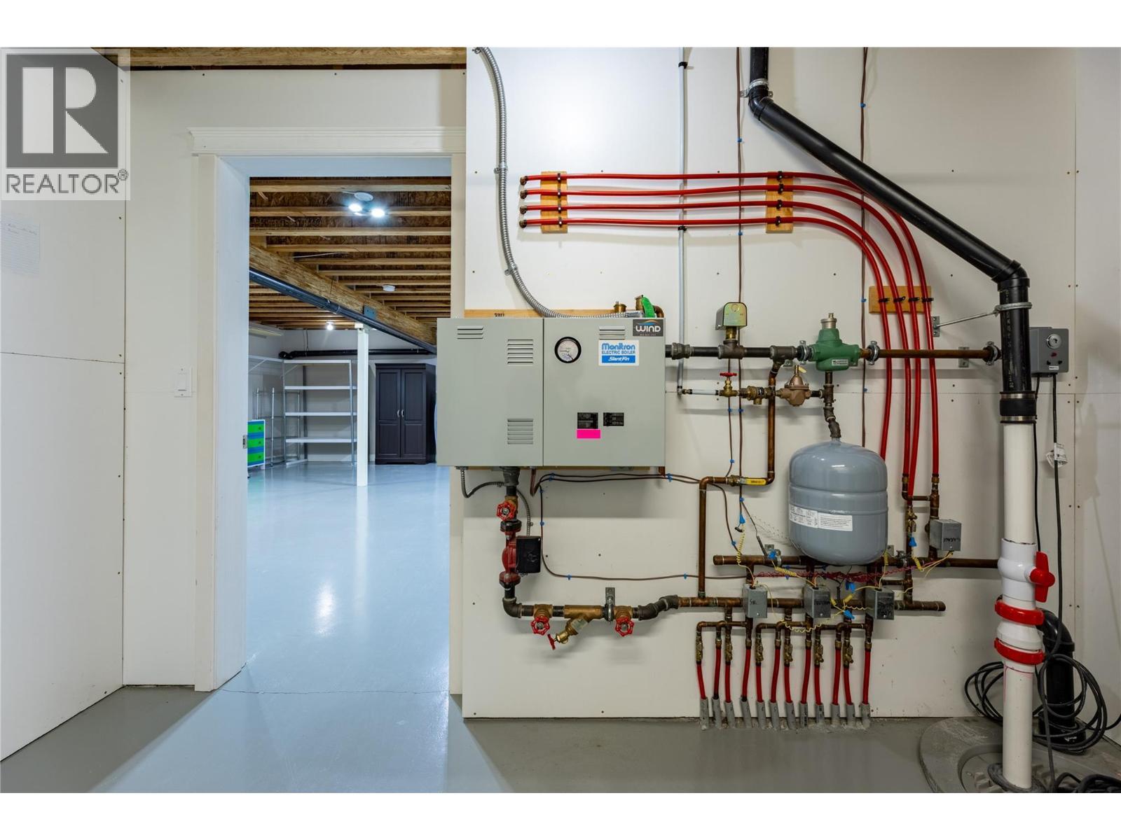 infloor heating in the basement and garage forced air and central air in the home as well - 6421 Eagle Bay Road Unit# 13, Eagle Bay, BC