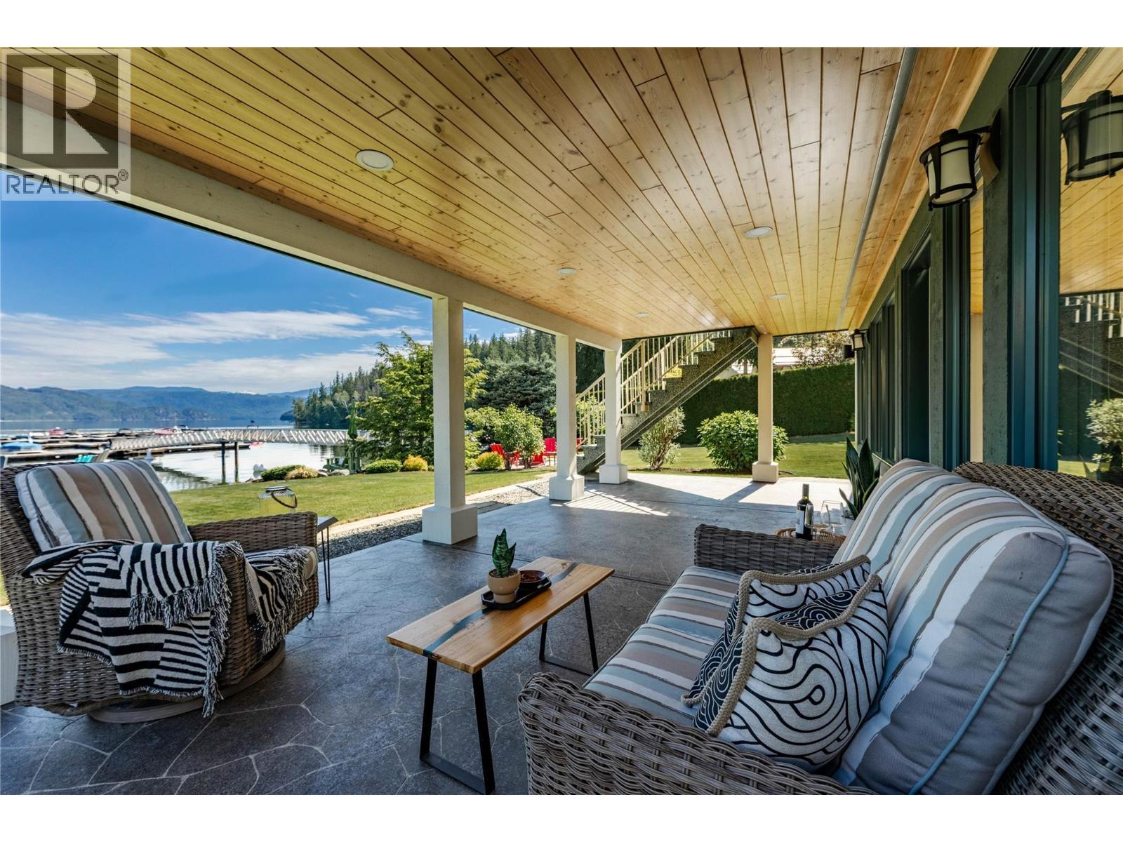 covered downstairs stamped concrete patio great place to catch a nap in the shade - 6421 Eagle Bay Road Unit# 13, Eagle Bay, BC