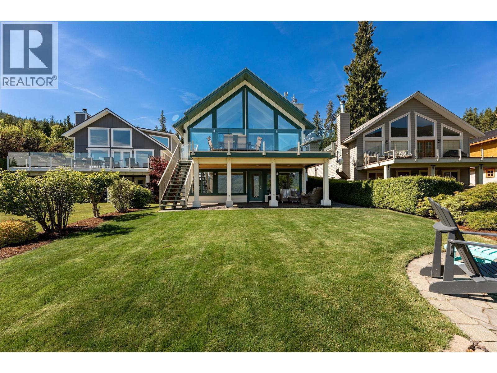 positioned slightly forward from the neighbours give this home exceptional views - 6421 Eagle Bay Road Unit# 13, Eagle Bay, BC