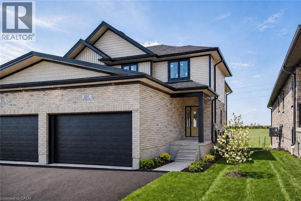 Contemporary exterior featuring light-colored brick and horizontal siding - 114 Bedell Drive, Mapleton, ON - Outdoor