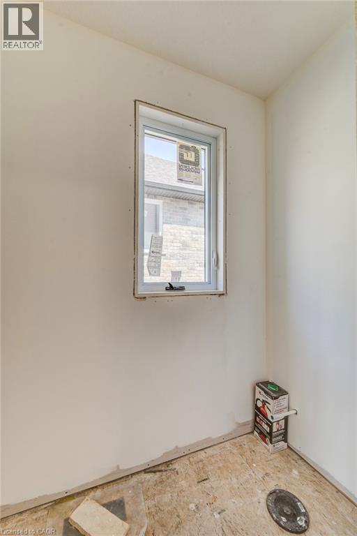 2 pc bathroom - 114 Bedell Drive, Mapleton, ON - Indoor Photo Showing Other Room