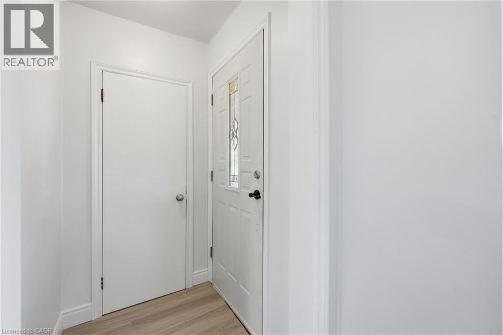 Entryway featuring wood-finish flooring - 97 Tragina Avenue S, Hamilton, ON