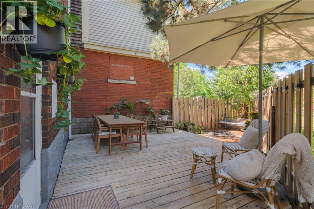 Expansive wood deck with a privacy fence - 41 Park Row N, Hamilton, ON