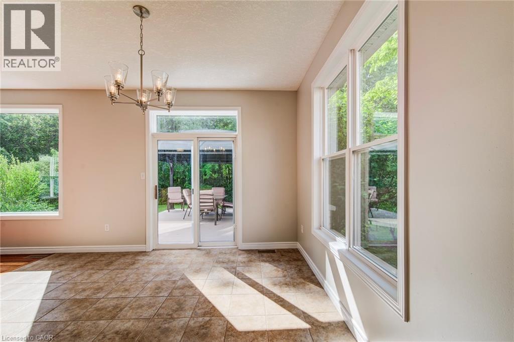 Plenty of windows, walk-out to deck. - 712 Brookmill Place, Waterloo, ON