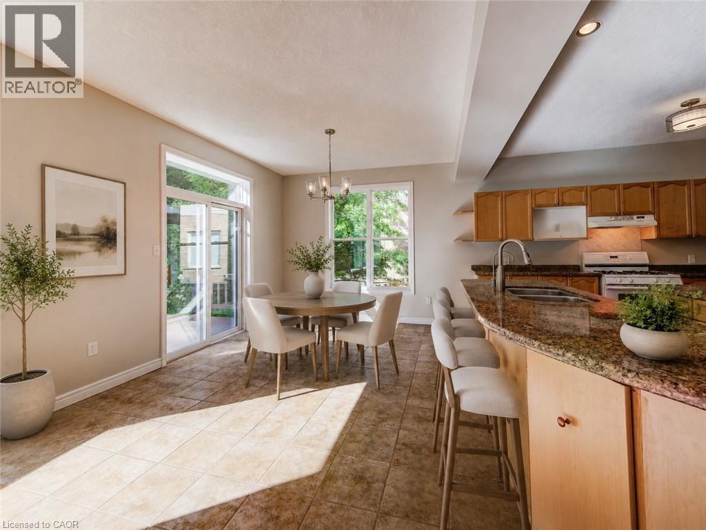 Virtually staged dining area. - 712 Brookmill Place, Waterloo, ON