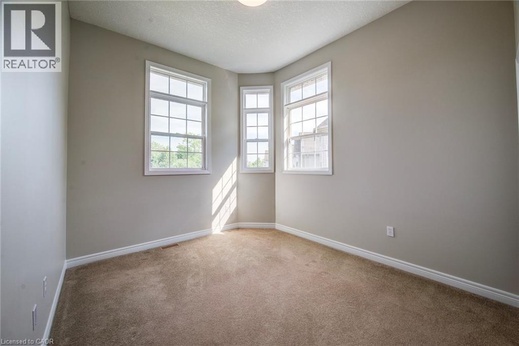 One of 5 upper bedrooms, this with high ceilings for added light. - 712 Brookmill Place, Waterloo, ON