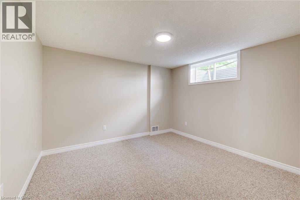 One of two bedrooms in lowest level. - 712 Brookmill Place, Waterloo, ON