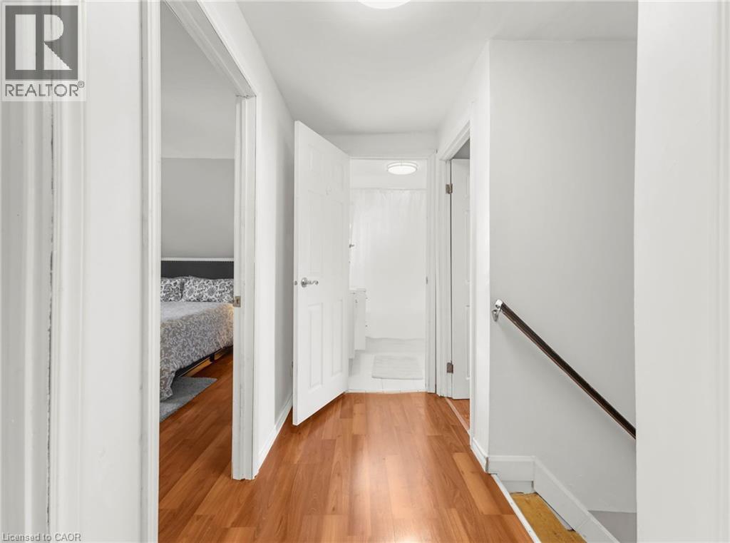 Hardwood-finish flooring extending through the hallway - 420 Waverly Street, Hamilton, ON
