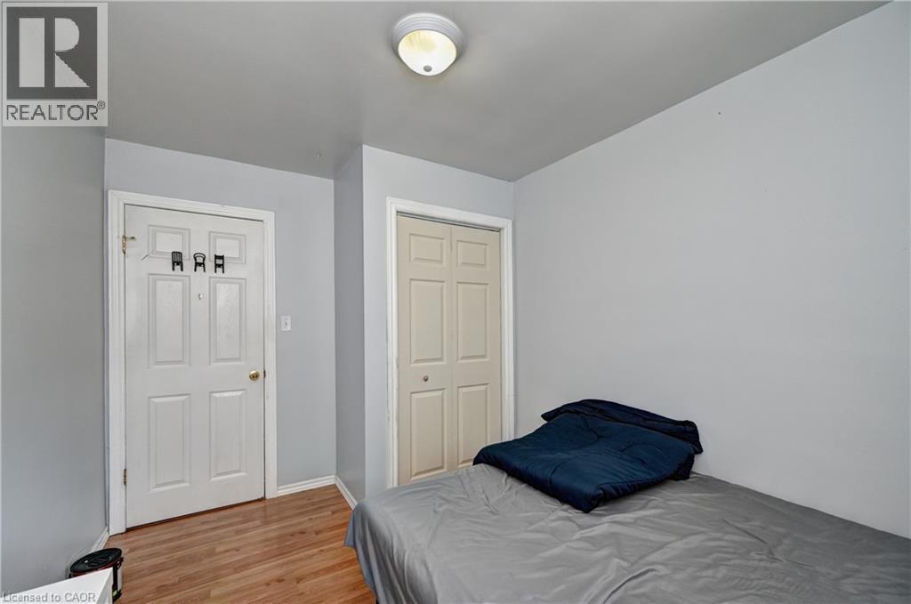 Light gray wall tones with wood-finish flooring - 525 Fallingbrook Drive, Waterloo, ON